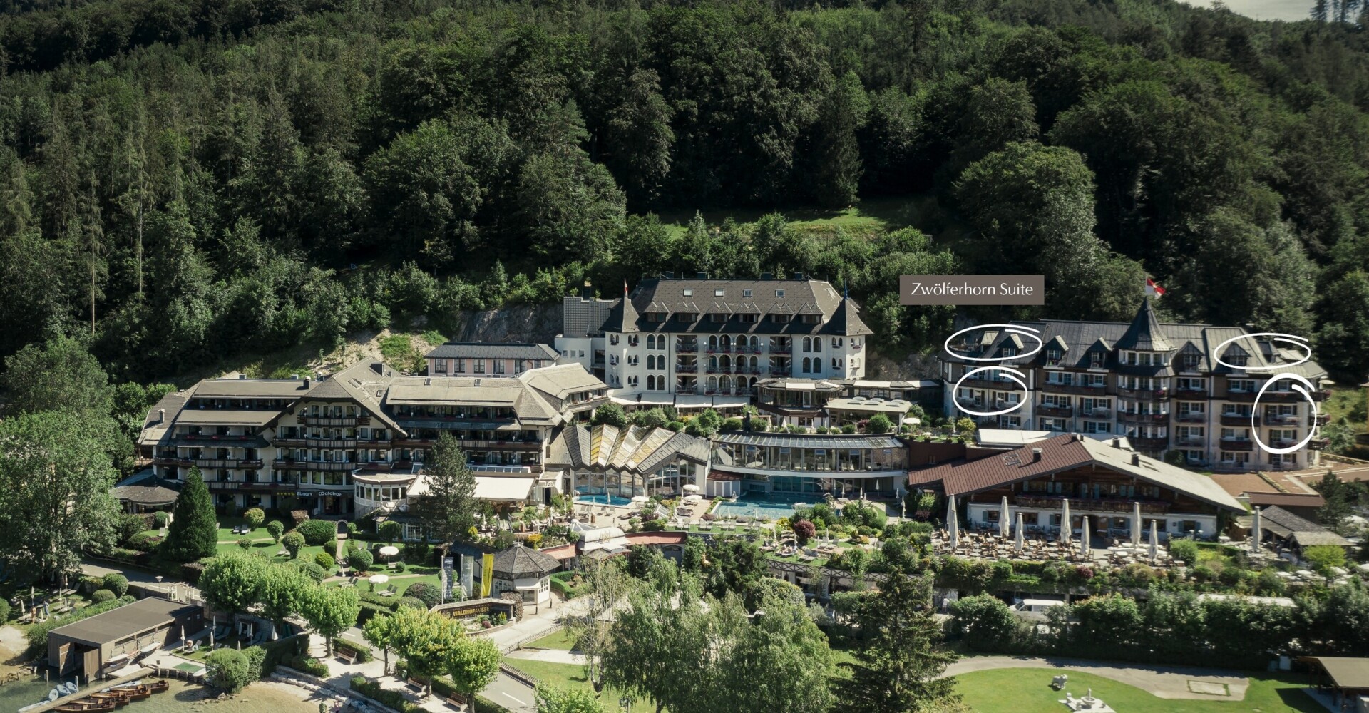 Aerial view of Waldhof Fuschlsee Resort with labeled "Zwölferhorn Suite."