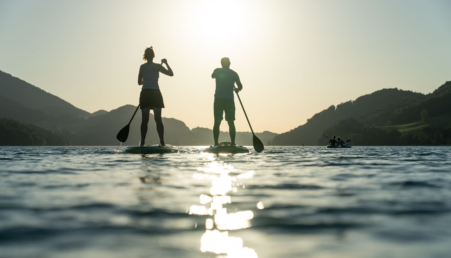Mountainbiker bei einer Pause im Aktivurlaub am Fuschlsee und im Salzkammergut.